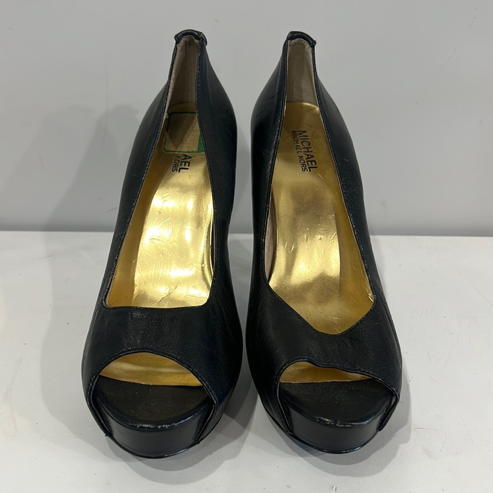 Michael Kors Black Leather Peep-Toe Pump. Heel height 4.5 inches